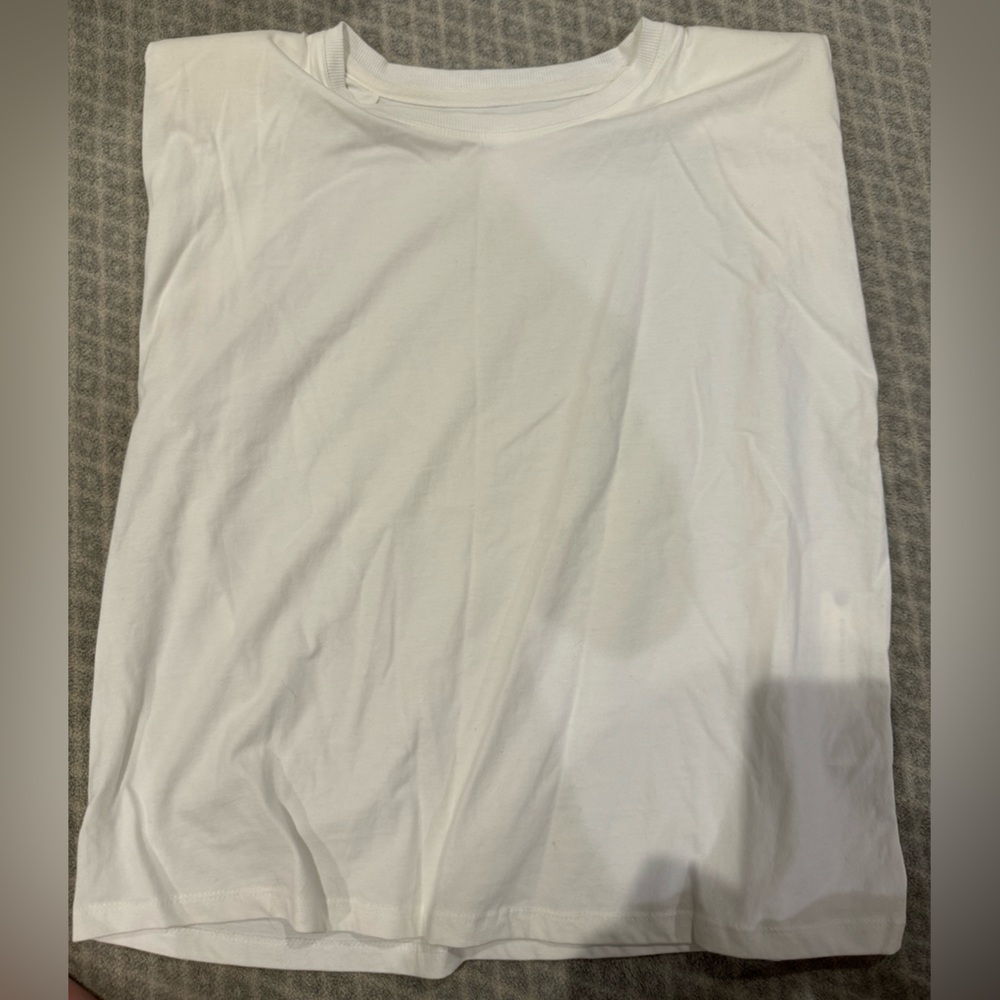 Pilcro solid white/cream top with some shoulder pads, sleeveless, size L